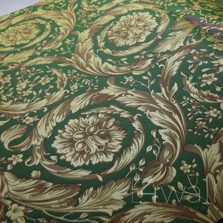 Złota tapeta na zielonym tle 